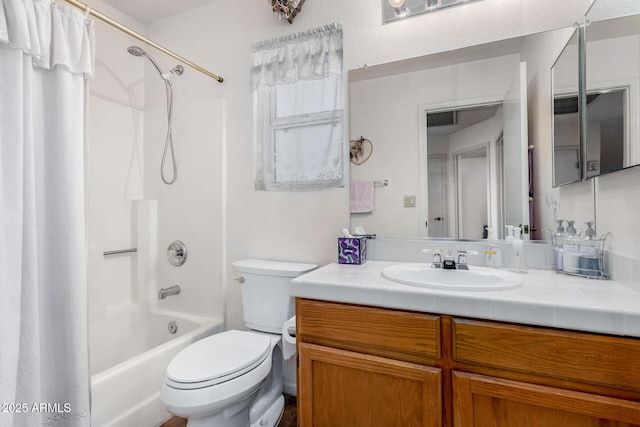 full bathroom featuring toilet, vanity, and shower / bathtub combination with curtain