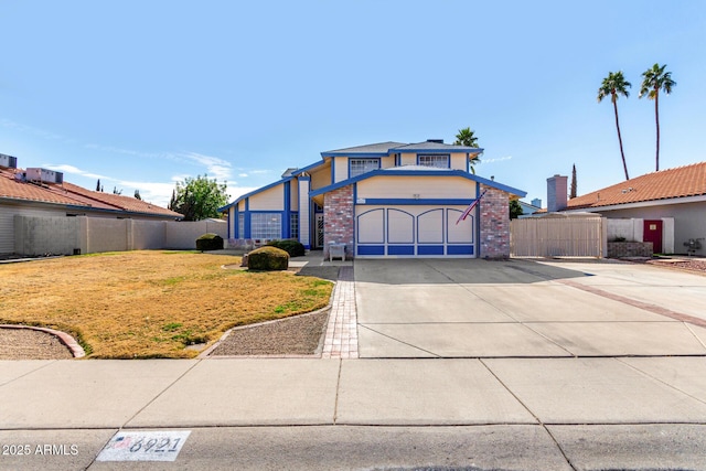 view of front facade with a garage, central AC, and a front lawn