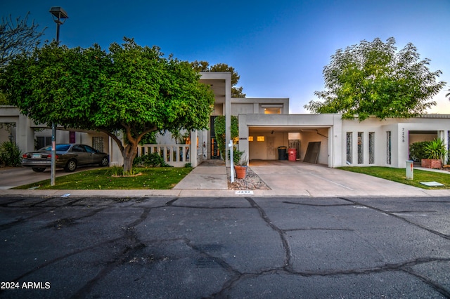 view of front of home featuring a carport