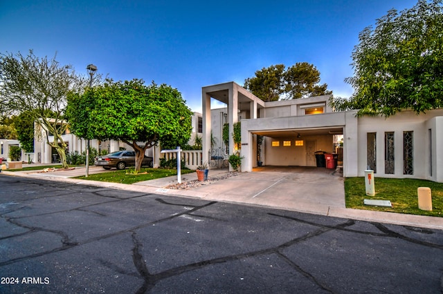 contemporary home featuring a carport