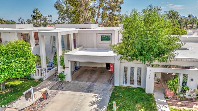 contemporary house featuring a carport