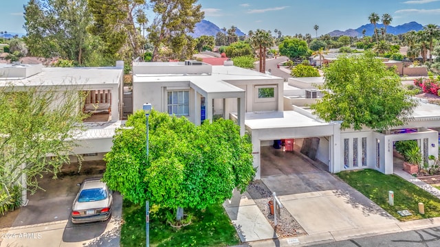 view of front of home featuring a mountain view and a carport