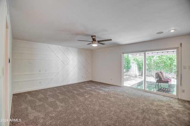 carpeted empty room with ceiling fan