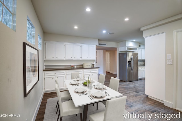 dining area with dark hardwood / wood-style floors