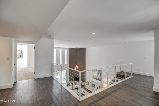 hallway featuring dark hardwood / wood-style floors