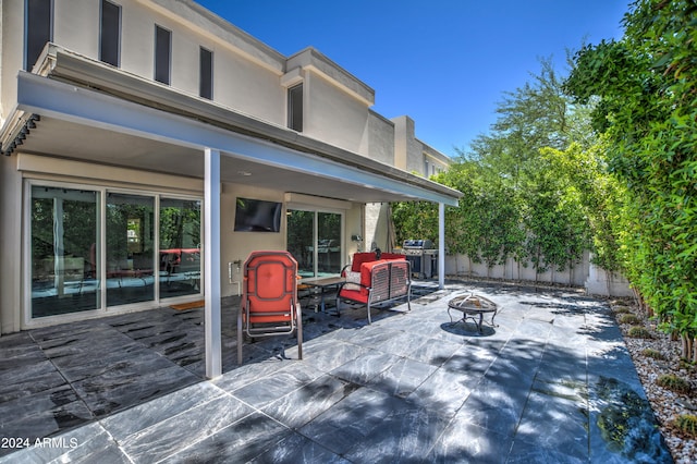 view of patio / terrace with a fire pit