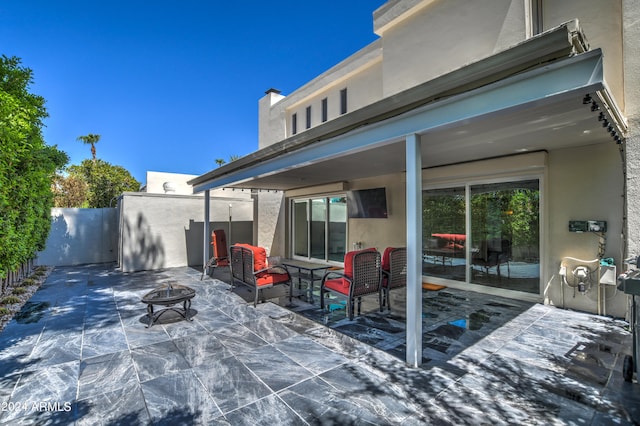 view of patio / terrace featuring a fire pit