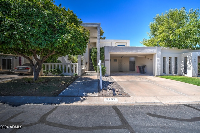 view of front of house with a carport