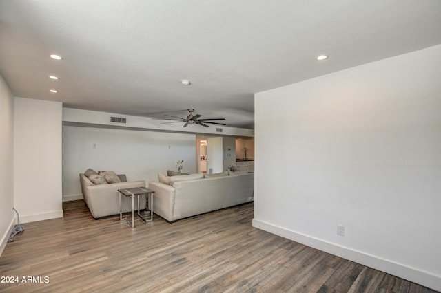 living room with hardwood / wood-style floors and ceiling fan