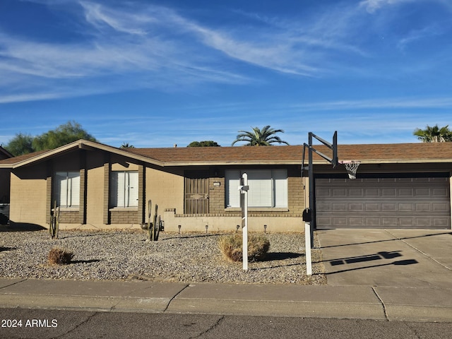 ranch-style house featuring a garage