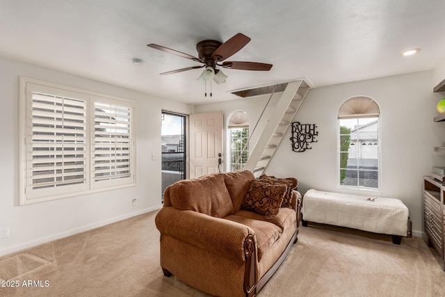 bedroom featuring ceiling fan and light colored carpet