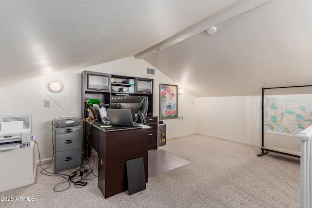 carpeted office with lofted ceiling with beams and a textured ceiling