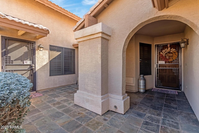 doorway to property featuring a patio area