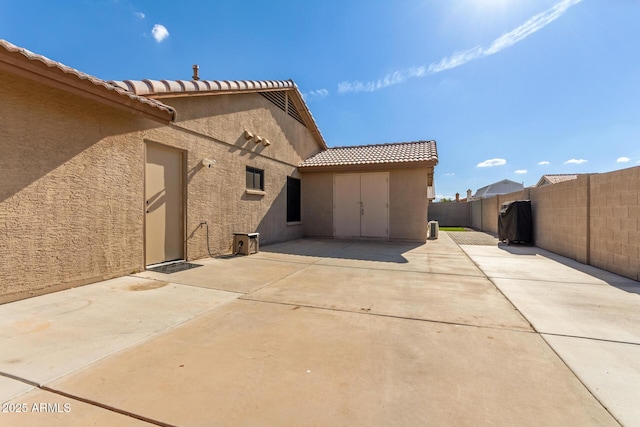 back of house featuring a patio area