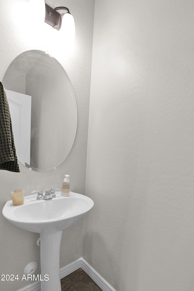 bathroom with tile patterned floors