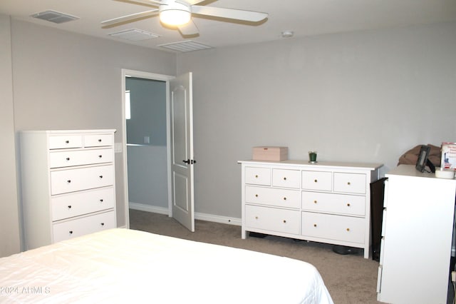 bedroom with ceiling fan and dark colored carpet