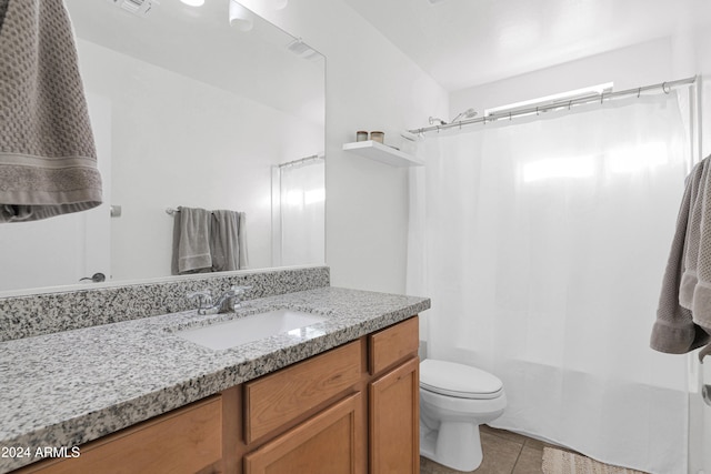 bathroom featuring tile patterned floors, toilet, and vanity