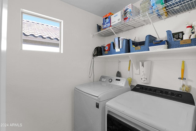 washroom featuring washer and clothes dryer