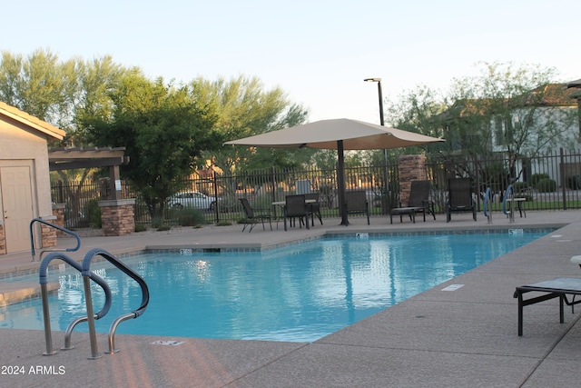 view of swimming pool with a patio area