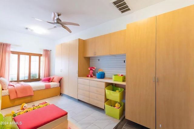 recreation room featuring ceiling fan and light tile patterned flooring