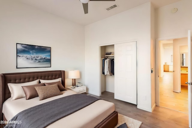 bedroom with a closet, ceiling fan, and hardwood / wood-style flooring