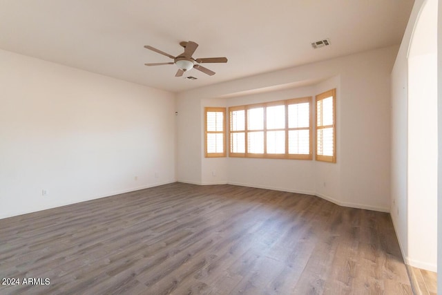 spare room featuring hardwood / wood-style flooring and ceiling fan