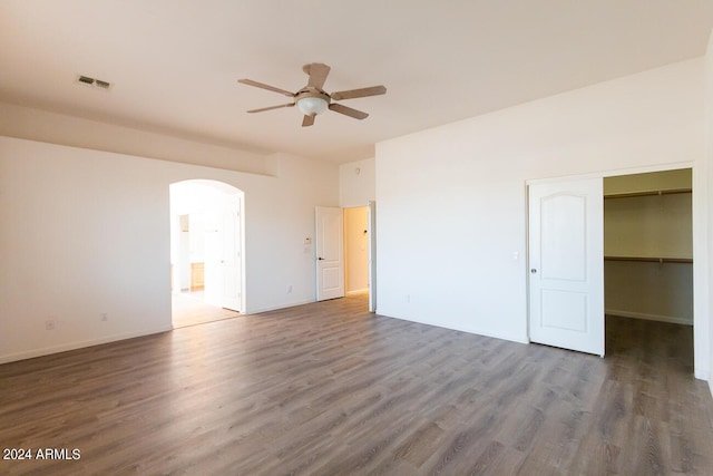 empty room featuring ceiling fan and dark hardwood / wood-style floors