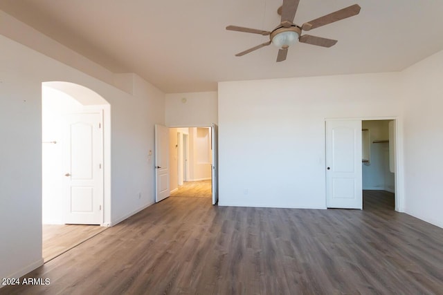 unfurnished room featuring ceiling fan and dark hardwood / wood-style flooring