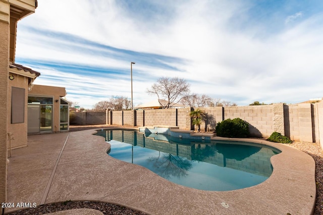 view of swimming pool with a patio area