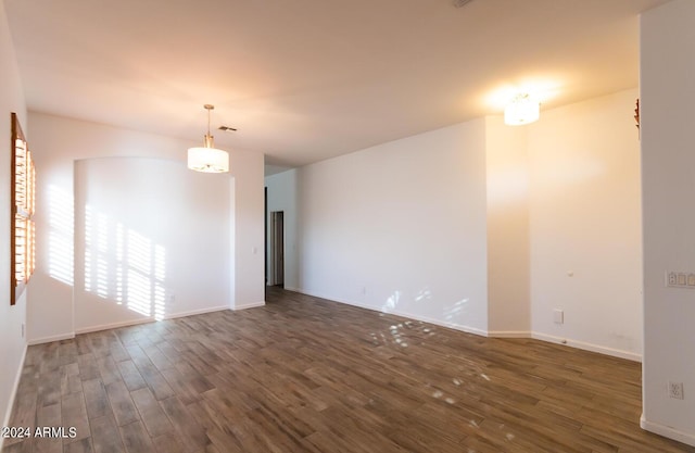 unfurnished room featuring dark hardwood / wood-style floors