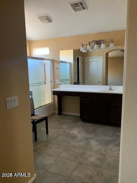 full bath featuring double vanity, tile patterned flooring, a sink, and visible vents