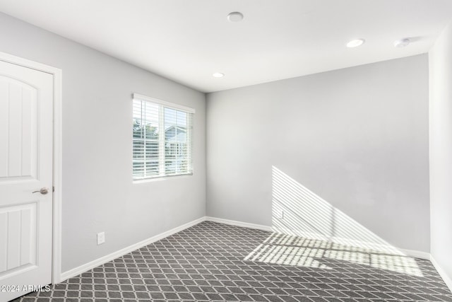 unfurnished room with carpet floors