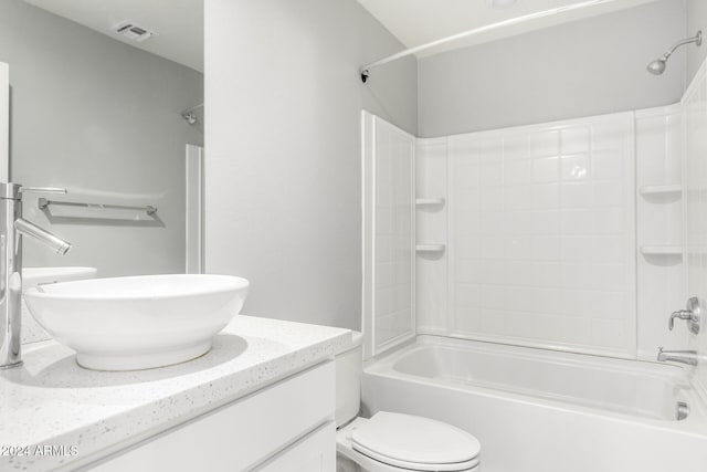 full bathroom featuring vanity,  shower combination, and toilet