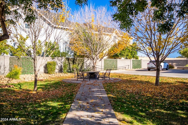 view of property's community with a patio area