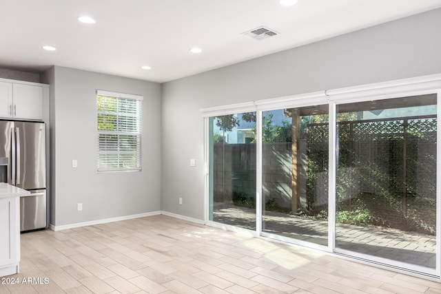 interior space featuring a wealth of natural light and light hardwood / wood-style floors