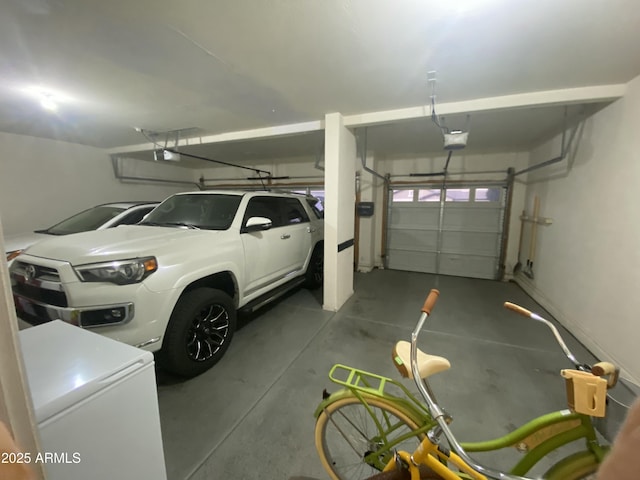 garage with a garage door opener and refrigerator