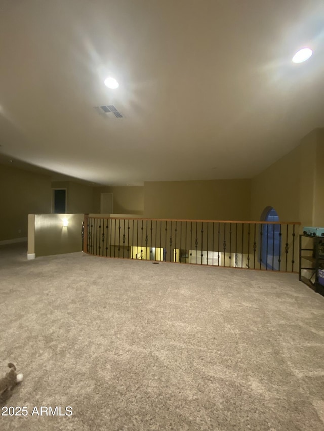 bonus room with lofted ceiling and carpet