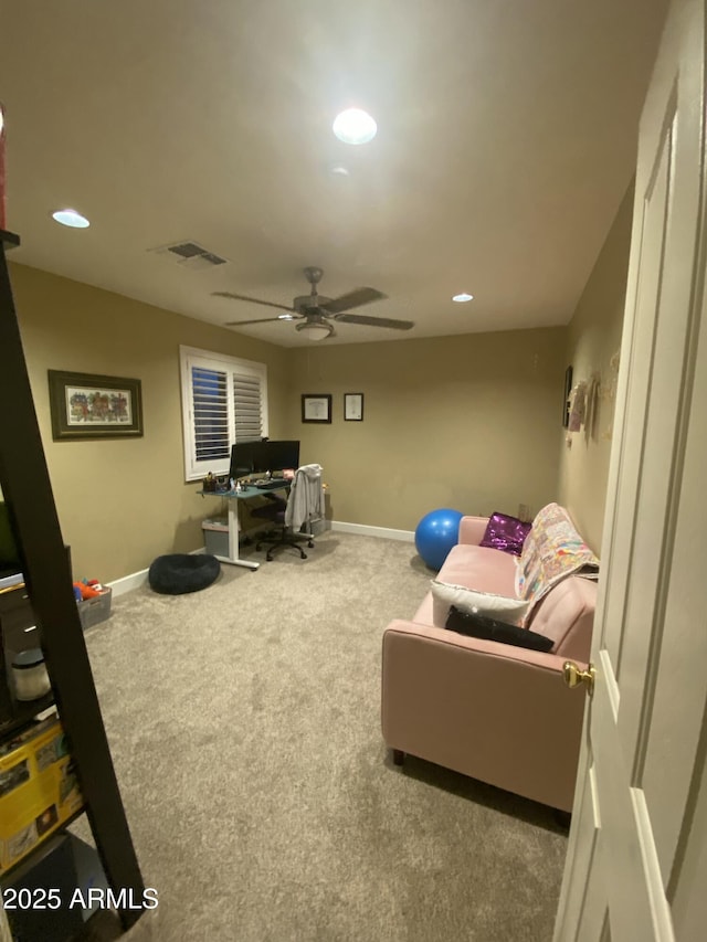 interior space with ceiling fan and carpet flooring