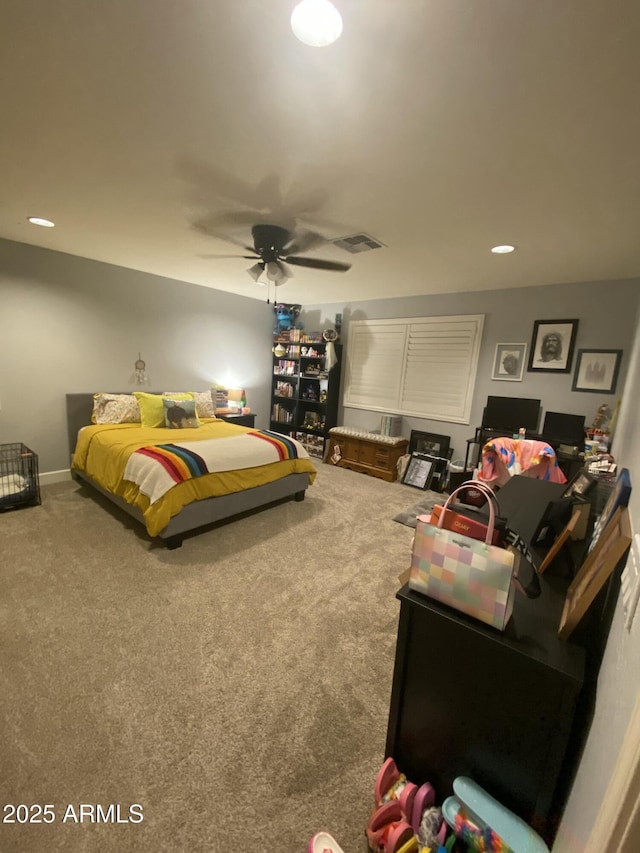 bedroom with ceiling fan and carpet