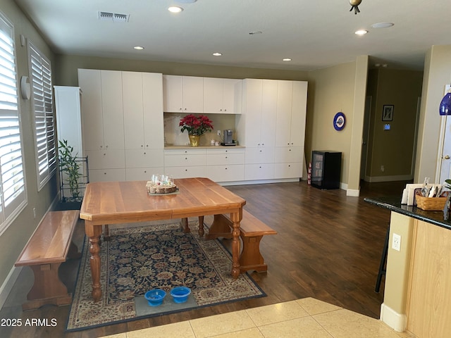 dining room with dark hardwood / wood-style floors