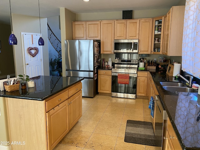 kitchen featuring stainless steel appliances, sink, and light brown cabinets