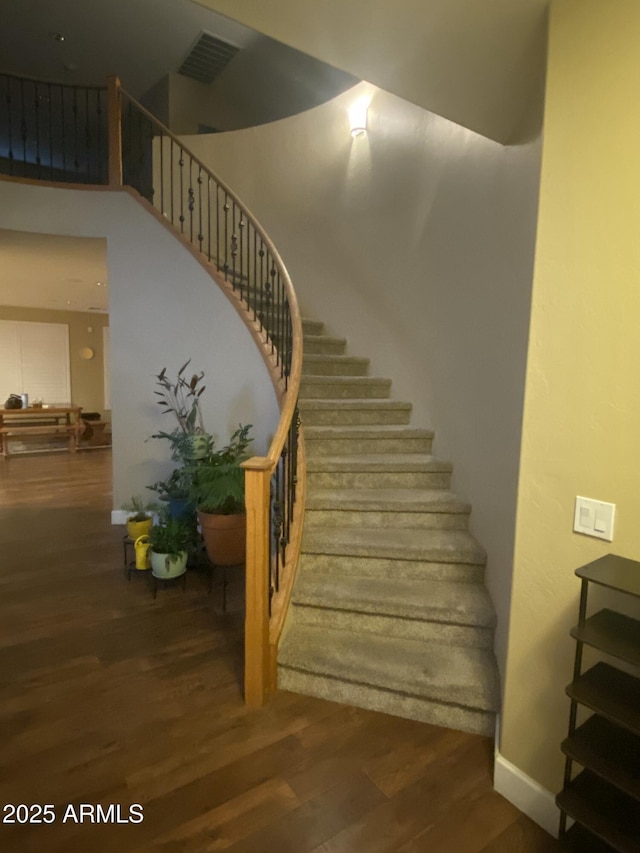 stairs with wood-type flooring