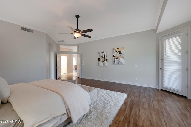 bedroom with ornamental molding, hardwood / wood-style floors, and ceiling fan