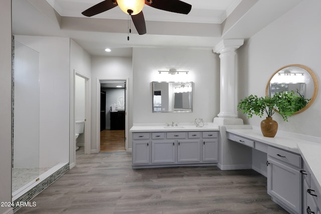 bathroom with vanity, hardwood / wood-style floors, toilet, and decorative columns