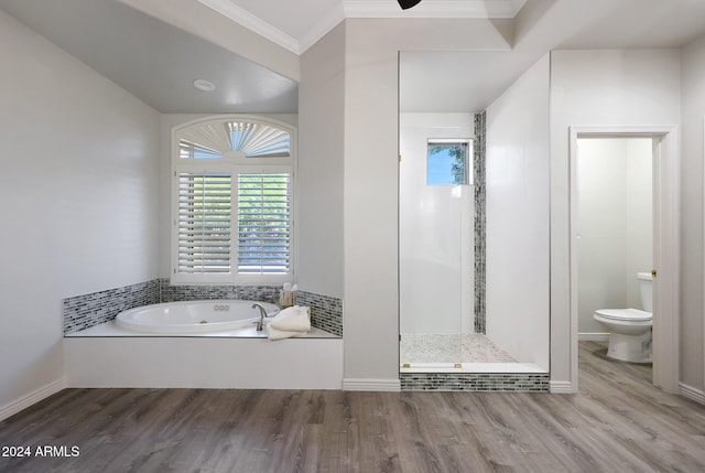 bathroom featuring toilet, wood-type flooring, ornamental molding, and separate shower and tub