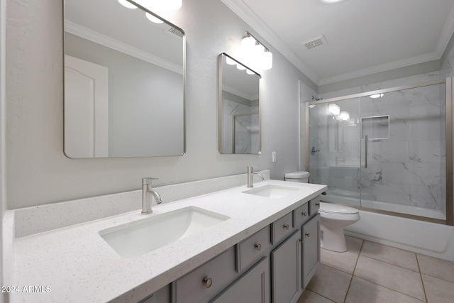 full bathroom featuring combined bath / shower with glass door, toilet, vanity, ornamental molding, and tile patterned flooring