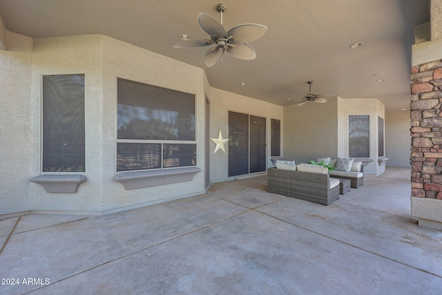 view of patio with outdoor lounge area and ceiling fan