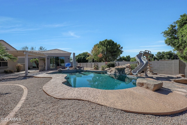 view of swimming pool featuring a water slide, a patio area, and a pergola