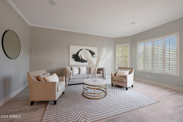 living room featuring ornamental molding and light wood-type flooring