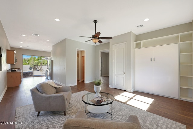 living room featuring light hardwood / wood-style flooring and ceiling fan